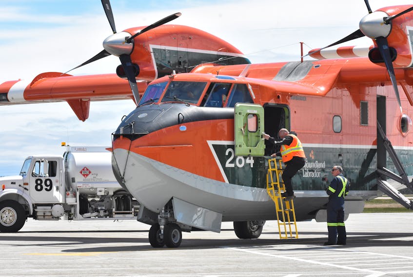 A CL-415 water bomber from Newfoundland and Labrador gets fueled up at the Yarmouth airport on Wednesday, May 11, before heading back out to the scene of a wildfire burning out of control in Yarmouth County. TINA COMEAU PHOTO