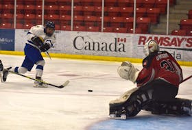 Kendrick Marshall of Team Atlantic, left, fires a shot on Team Ontario goaltender Maverick Fletcher during male action at the National Aboriginal Hockey Championships at the Membertou Sport and Wellness Centre, Wednesday. Team Ontario won the game 7-1. JEREMY FRASER/CAPE BRETON POST.
