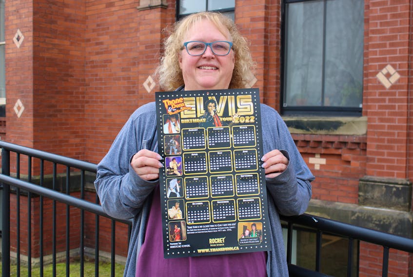 Laureen Rushton holds up a Thane Dunn calendar being sold in memory of her son, Lucas Rushton, who battled mental illness before he passed away last year. Proceeds are going to support out-of-city students attending Neptune Theatre School and mental health programming. 