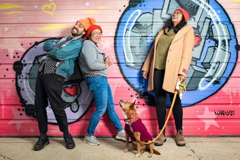 Toronto couple Amie and Diana share their life with rescue dog Nassau and housemate Kyle in this photo from the Don't You Want Me exhibit showing the love between members of the LGBTQ+ community and their canine companions.