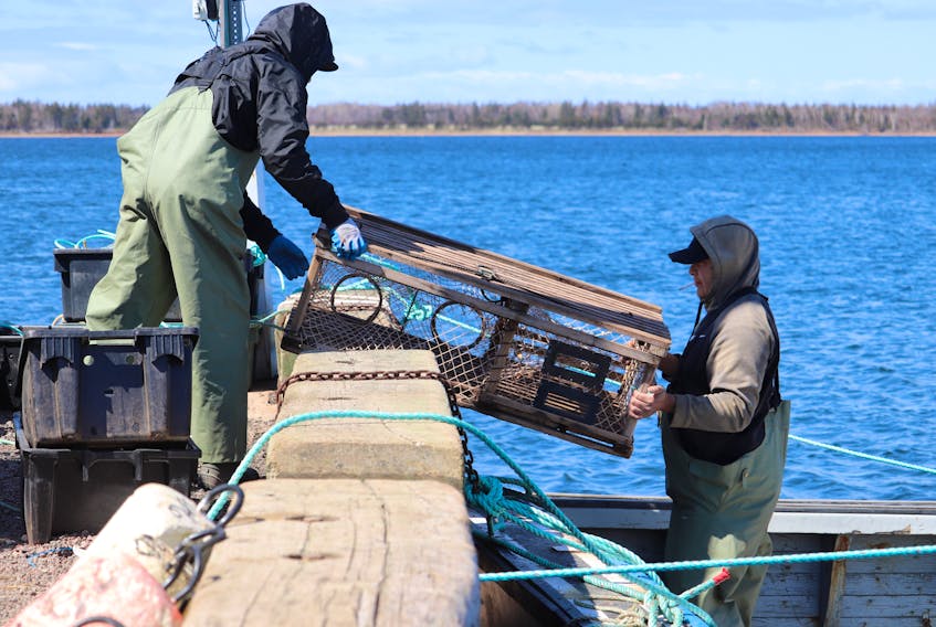 Fishers from Lennox Island load traps before taking to the water on May 7 for the first day of the community's moderate livelihood fishery. - Logan MacLean • The Guardian