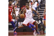 Toronto Raptors Kawhi Leonard SF (2) guarded by Philadelphia 76ers Ben Simmons PG (25) during the first half in Toronto, Ont. on Sunday May 12, 2019. 