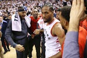 Toronto Raptors Kawhi Leonard SF (2) is congratulated by his teammates after the game in Toronto, Ont. on Sunday, May 12, 2019