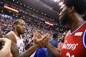 Toronto Raptors Kawhi Leonard SF (2) shakes hands with Philadelphia 76ers Joel Embiid C (21) after the game in Toronto, Ont. on Sunday, May 12, 2019