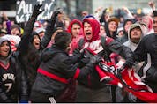 The Toronto Raptors' faithful  fans celebrate  in Jurassic Park as their Raptors play against the Philadelphia 76ers,   in Toronto, Ont. on Sunday, May 12, 2019