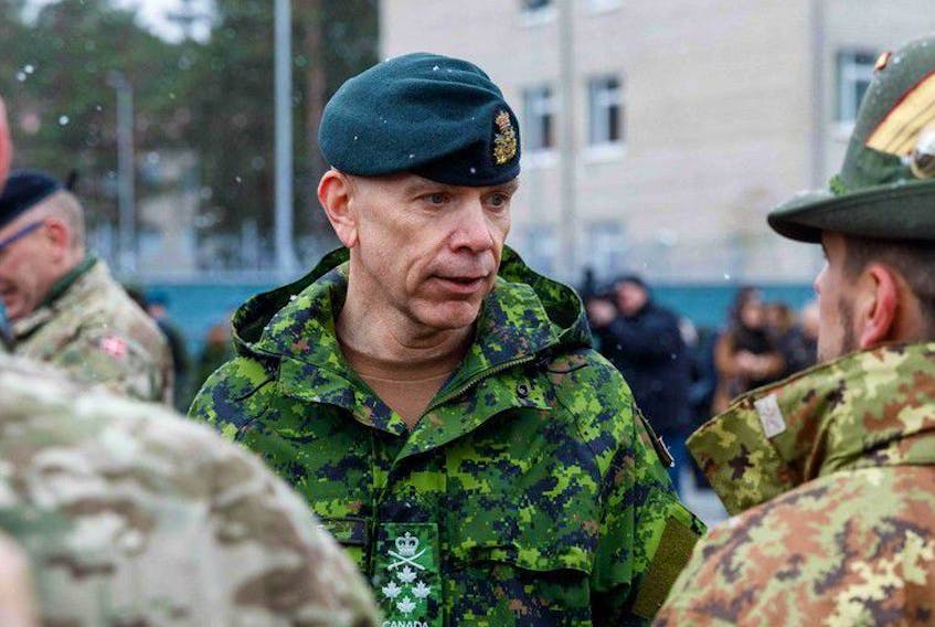 General Wayne Donald Eyre, chief of Canadian Defence Staff talks with soldiers at a military base, north east of Riga, Latvia, on March 8, 2022. 