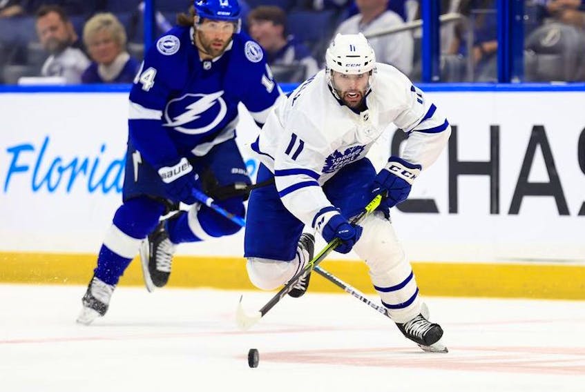 Colin Blackwell of the Toronto Maple Leafs looks to pass in the third period during Game Five of  the First Round of the 2022 Stanley Cup Playoffs against the Tampa Bay Lightning at Amalie Arena on May 12, 2022 in Tampa, Florida.