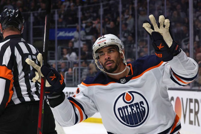 LOS ANGELES, CALIFORNIA - MAY 12: Evander Kane #91 of the Edmonton Oilers celebrates his empty net goal behind referee Frederick L'Ecuyer #17 during the third period in a 4-2 Oilers win in Game Six of the First Round of the 2022 Stanley Cup Playoffs at Crypto.com Arena on May 12, 2022 in Los Angeles, California.