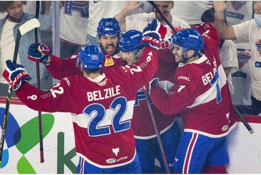 Rocket players celebrate a first-period goal by teammate Danick Martel (18) during AHL playoff action against Syracuse Crunch in Laval Thursday night.