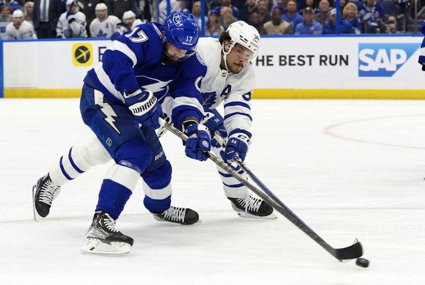 Tampa Bay Lightning left wing Alex Killorn shoots as Toronto Maple Leafs center Auston Matthews defends during the first period of game six of the first round of the 2022 Stanley Cup Playoffs at Amalie Arena. 