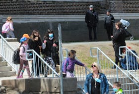 Students leave Bishop Feild elementary school on Bond Street in St. John's Friday.