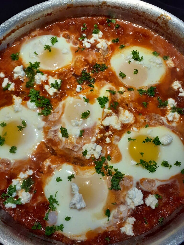 Shakshuka, cooked and ready to serve, is a perfect option for lunch at home.