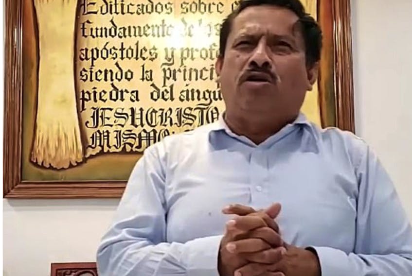 Pastor Rene Huezo in the church's YouTube videos.