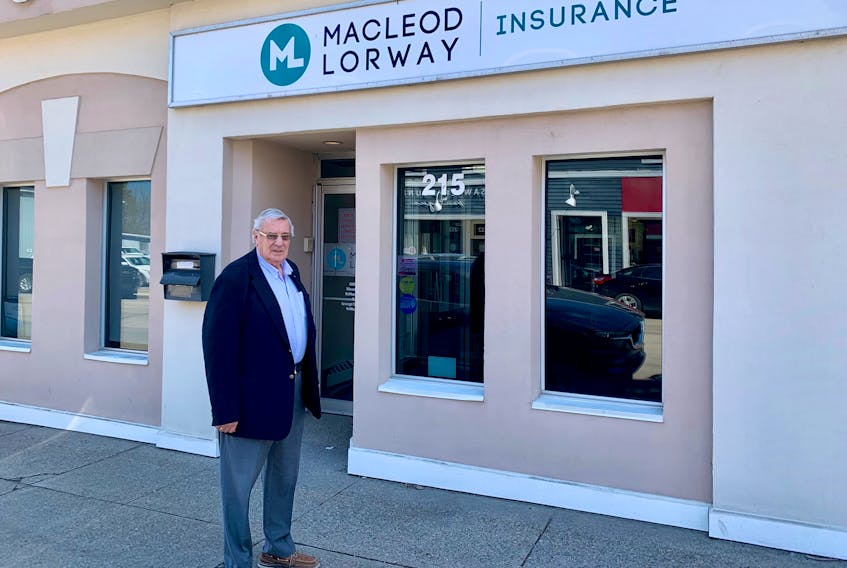 Stuart MacLeod stands outside the downtown Sydney building he has worked out of for the past 46 years. The president and CEO of the MacLeod Lorway Financial Group will be inducted into the Cape Breton Business and Philanthropy Hall of Fame on May 18. DAVID JALA/CAPE BRETON POST
