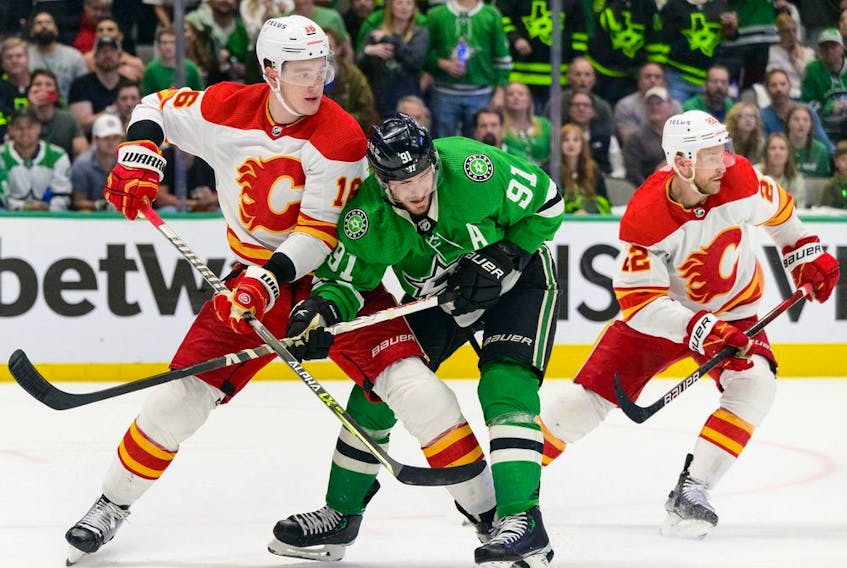  Calgary Flames defenceman Nikita Zadorov and forward Trevor Lewis defend against Dallas Stars forward Tyler Seguin during Game 6 of their first-round series at Airlines Center in Dallas on Friday, May 13, 2022.