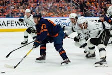 Edmonton Oilers' Connor McDavid (97) battles L.A. Kings' Anze Kopitar (11) during first period NHL Stanley Cup playoffs action at Rogers Place in Edmonton, on Saturday, May 14, 2022.