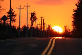 The sun sets May 14 over Highway 8, which connects Annapolis Royal and Liverpool. The temperature hit 31.3 C at Kejimkujik National Park at 3 p.m. on May 14. It shattered the Environment Canada record for May 14 for the area of 24.5 C set in 2012.