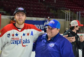 Summerside D. Alex MacDonald Ford Western Capitals general manager Pat McIver chats with forward Colby MacArthur of Summerside as the team celebrated winning the 2021-22 Maritime Junior Hockey League (MHL) championship on home ice May 2. The Capitals are representing the MHL at the Centennial Cup national championship in Estevan, Sask., from May 19 to 29. Jason Simmonds • Journal Pioneer
