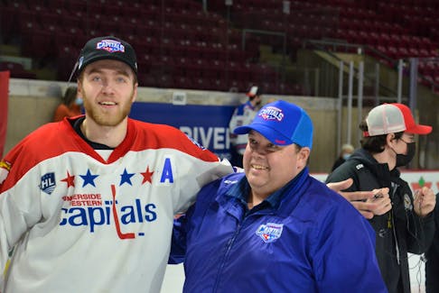 Summerside D. Alex MacDonald Ford Western Capitals general manager Pat McIver chats with forward Colby MacArthur of Summerside as the team celebrated winning the 2021-22 Maritime Junior Hockey League (MHL) championship on home ice May 2. The Capitals are representing the MHL at the Centennial Cup national championship in Estevan, Sask., from May 19 to 29. Jason Simmonds • Journal Pioneer