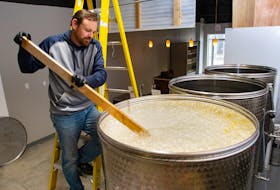 Eric Hynes, co-owner of Eventide Mead, degasses the mead in a fermentation tank at his Burnside operation on Monday, May 16, 2022. 
Ryan Taplin - The Chronicle Herald
