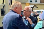 Nipissing PC candidate Vic Fedeli, right, greets Ontario PC Leader Doug Ford in North Bay on May 10, 2022.