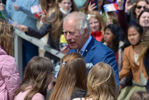 Prince Charles stops to chat with some junior high students that greeted him and his wife Camilla, the Duchess of Cornwall, upon arrival at Confederation Building in St. John's.
