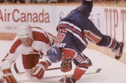  Edmonton Oilers forward Glenn Anderson collides with Calgary Flames defenceman Frank Musil during their 1991 series.