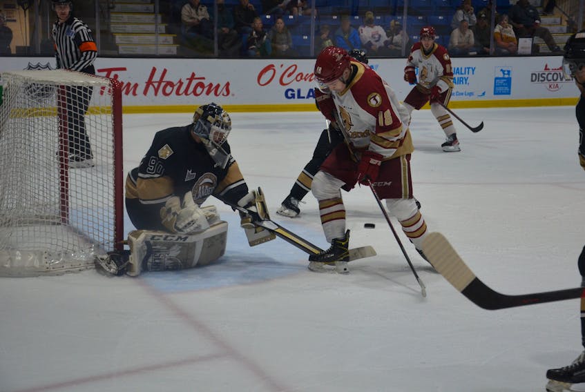Charlottetown Islanders goaltender Franky Lapenna, 90, tracks the puck as the Acadie-Bathurst Titan’s Thomas Belgarde, 18, positions himself for a redirection or rebound. The action took place during a Quebec Major Junior Hockey League playoff game at Eastlink Centre in Charlottetown on May 16. Lapenna made 29 saves as the Islanders defeated the Titan 5-1 to take a 2-0 lead in the best-of-five series.