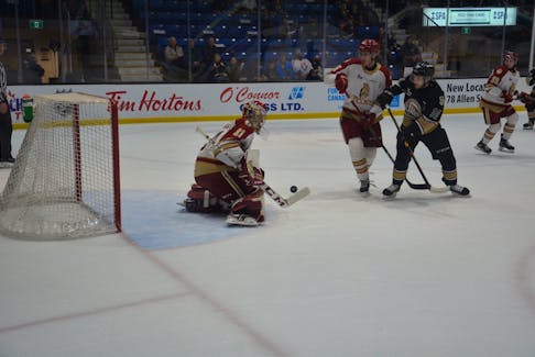 Charlottetown Islanders forward and team captain Brett Budgell, 10, follows his shot on Acadie-Bathurst Titan goaltender Jan Bednar during a Quebec Major Junior Hockey League playoff game at Eastlink Centre on May 16. The Titan’s Marc-Andre Gaudet, 45, defends against Budgell. Charlottetown won the game 5-1, and leads the best-of-five series 2-0.