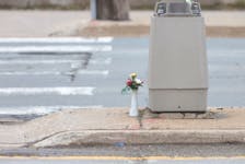Flowers are placed on a traffic island at a pedestrian crosswalk on Herring Cove at Sylvia Avenue near the scene of Halifax latest homicide they claim the life of a 37-year-old woman in Halifax Tuesday, May 17, 2022.

TIM KROCHAK PHOTO