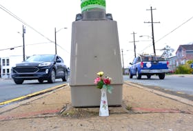 Flowers are placed on a traffic island at a pedestrian crosswalk on Herring Cove at Sylvia Avenue near the scene of Halifax latest homicide they claim the life of a 37-year-old woman in Halifax Tuesday, May 17, 2022.

TIM KROCHAK PHOTO