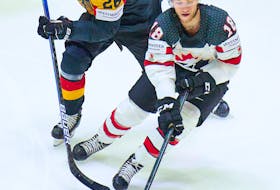 Samuel Soramies Nr.26 of Germany compete, fight for the puck against, Dawson Mercer Nr. 18 of Canada in the match GERMANY - CANADA 3-5 IIHF Ice hockey, Eishockey World Championship, WM, Weltmeisterschaft Group B in Helsinki, Finland, May 13, 2022, Season 2021/2022No Use Switzerland. No Use Germany. No Use Japan. No Use Austria  Samuel Soramies (26) of Germany fights for the puck against, Dawson Mercer (18) of Canada in the match between Germany and Canada May 13. Photo by Andrea Branca/Just Pictures/Sipa USA