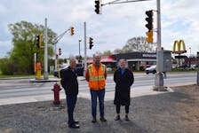 A new pedestrian crossing on East River Road in New Glasgow will go live on May 19. From left are: Const. Ken Macdonald, Civil Engineering Technologist Adam Langille and Active Living Manager Veronica Deno.