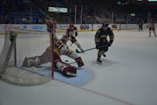 Charlottetown Islanders forward Zac Roy, 8, releases a shot on Acadie-Bathurst Titan goaltender Jan Bednar, 31, in a Quebec Major Junior Hockey League playoff game at Eastlink Centre earlier this week. Titan defenceman Cole Larkin, 5, of Mermaid hustles back to clear a possible rebound. The Islanders won the first two games of the best-of-five series. The teams play Game 3 in Bathurst, N.B., on May 19.