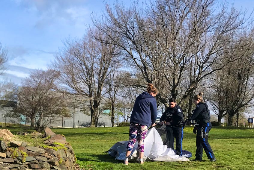 Robin Tress was walking her dog in Dartmouth Common Wednesday, May 18, 2022 when she witness police evicting a people from a tent. - Robin Tress
