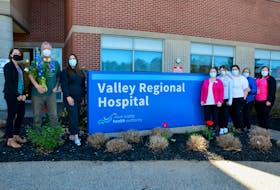 Valley Regional Hospital Foundation fund development co-ordinator Hillary Webb; Two Birds One Stone Farm owners Kenny and Sarah Macalpine, registered nurses Gillianne Blanchard, Emily Wayne, Adrianna Martin and Shawna Decker and Valley Regional Hospital Women and Children’s Program manager Michelle Harris gather outside of the regional hospital in Kentville as the Macalpines deliver a bouquet of flowers ordered by Harris in recognition of Nurses Week. KIRK STARRATT