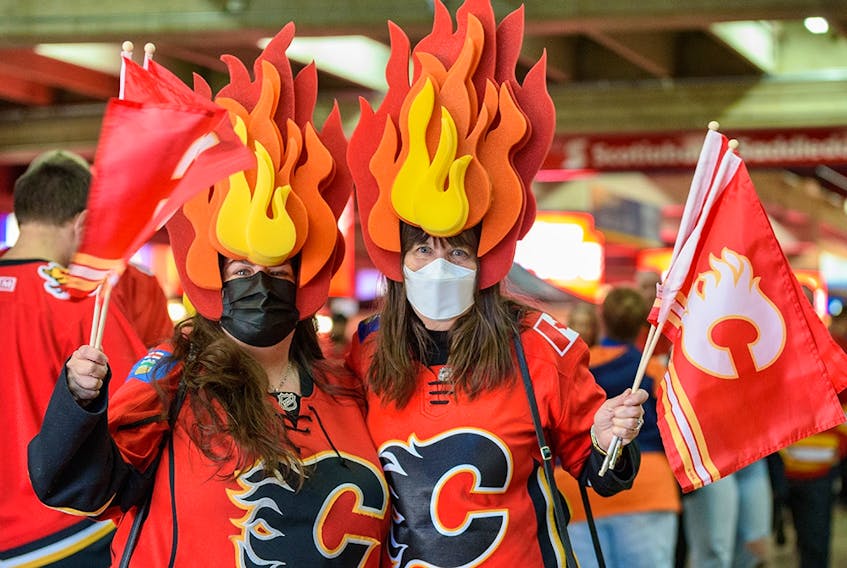  Flame-heads Tania Stephenson, left, and Shauna Roth get ready for Game 1 of the second round of playoff action between Calgary Flames and Edmonton Oilers at Scotiabank Saddledome on Wednesday, May 18, 2022.