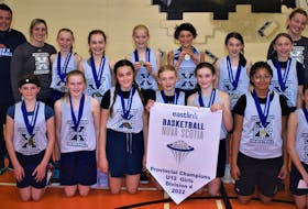 Jr. X-Women gather with their gold medals and provincial banner. Pictured are Katie MacNeil (back, left), coach Shawn Whitty, coach Nicole Cleary, Gracie Cleary, Abby Cowan, Taylor Keats, Elizabeth Marshall, Ali Chisholm, Ella Robinson, coach Gemma MacPherson, head coach Gail MacDougall, Edyn McFarlane (front, left), Bridgette Whitty, Sadie Hines, Lia Wasserman, Kate Spencer, Ava Heighton, and Sophie Fougere.