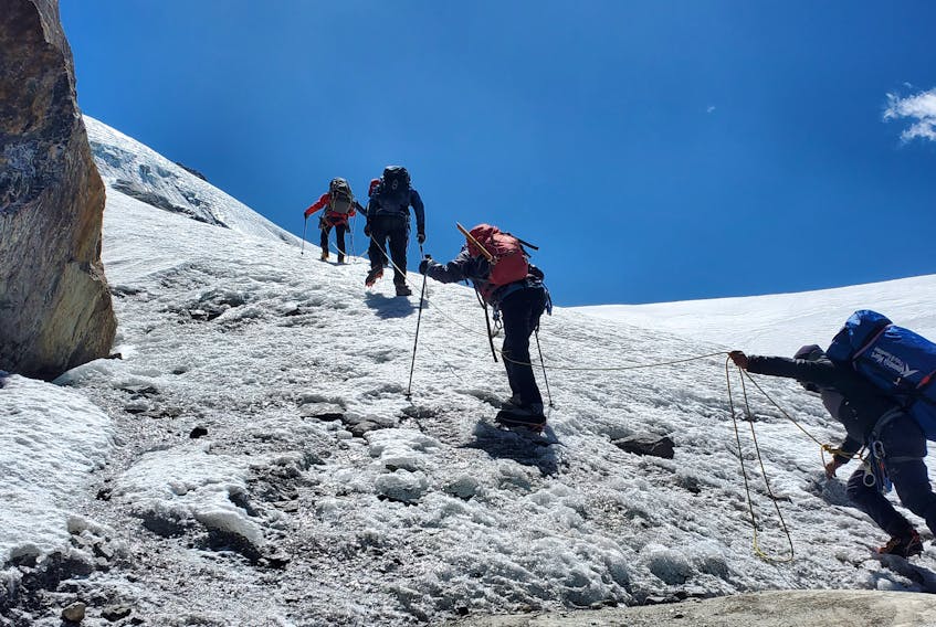 Byron Hiscock is accompanied by a crew including his sherpa and porter as they make their way up the Mera Peak in the Himalayas.