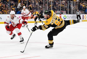 May 12, 2022; Boston, Massachusetts, USA; Boston Bruins left wing Brad Marchand (63) attempts a shot against the Carolina Hurricanes during the first period at the TD Garden. Mandatory Credit: Brian Fluharty-USA TODAY Sports  Boston Bruins left-winger Brad Marchand (63) takes a shot against the Carolina Hurricanes during a May 12 playoff game at the TD Garden in Boston. - Brian Fluharty-USA TODAY Sports