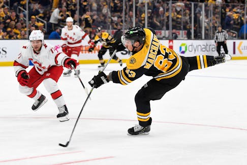 May 12, 2022; Boston, Massachusetts, USA; Boston Bruins left wing Brad Marchand (63) attempts a shot against the Carolina Hurricanes during the first period at the TD Garden. Mandatory Credit: Brian Fluharty-USA TODAY Sports  Boston Bruins left-winger Brad Marchand (63) takes a shot against the Carolina Hurricanes during a May 12 playoff game at the TD Garden in Boston. - Brian Fluharty-USA TODAY Sports