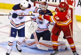 Calgary Flames forward Matthew Tkachuk battles Edmonton Oilers goalie Mikko Koskinen during Round 2 of the Western Conference finals at the Scotiabank Saddledome in Calgary on Wednesday, May 18, 2022.