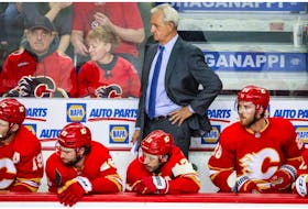  May 18, 2022; Calgary, Alberta, CAN; Calgary Flames head coach Darryl Sutter on his bench against the Edmonton Oilers during the third period in game one of the second round of the 2022 Stanley Cup Playoffs at Scotiabank Saddledome.