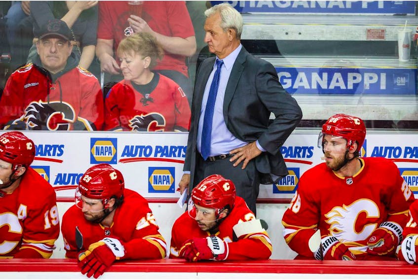  May 18, 2022; Calgary, Alberta, CAN; Calgary Flames head coach Darryl Sutter on his bench against the Edmonton Oilers during the third period in game one of the second round of the 2022 Stanley Cup Playoffs at Scotiabank Saddledome.