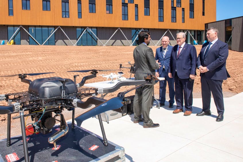 Aitazaz Farooque, associate dean, UPEI School of Climate Change and Adaptation and the Canadian Centre of Climate Change and Adaptation, describes drone technology to UPEI president Greg Keefe, P.E.I. MP Lawrence MacAulay and P.E.I. Premier Dennis King at the official opening of the Centre at St. Peter's Bay, P.E.I.