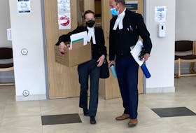 Sarah Kirby and Rick Woodburn,  the prosecutors at Kaz Henry Cox's first-degree murder trial, leave Nova Scotia Supreme Court in Dartmouth on Thursday.