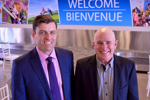 Charlottetown Airport CEO Doug Newson, left, welcomes the incoming president of the board, Steve Loggie, at the airport's annual public meeting May 2 at the Charlottetown Airport international arrivals area.