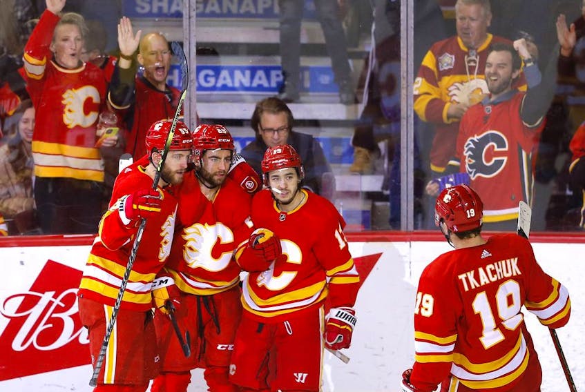  The Flames celebrate a goal by Dillon Dube on March 16, 2022.
