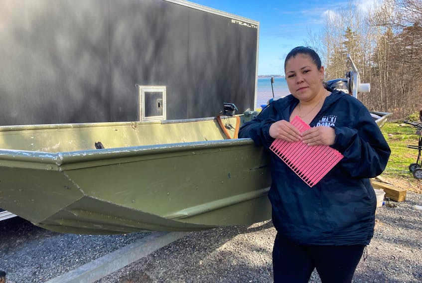 Sylvia Bernard with tags for her lobster traps issued by the Pictou Landing First Nation that will for the first time be respected by DFO.