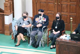 Second World War veteran Bill Saunders, 100, waits in the House of Assembly at Confederation Building on Monday with two family members, and members of the Royal Canadian Legion Branch 1 nearby. A statement was read honouring Saunders for his war service. 
